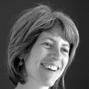 Ros Davies, a black-and-white photograph of a light-skinned person with shoulder-length brown hair.