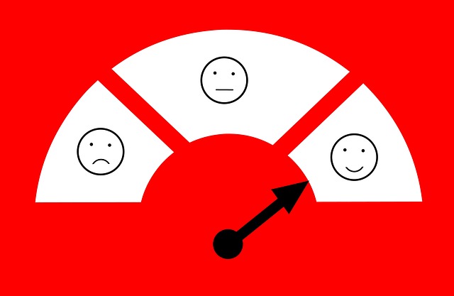 A customer service scale for measuring customer satisfaction with an unhappy face (left), a neutral face (centre), and a happy face (right).