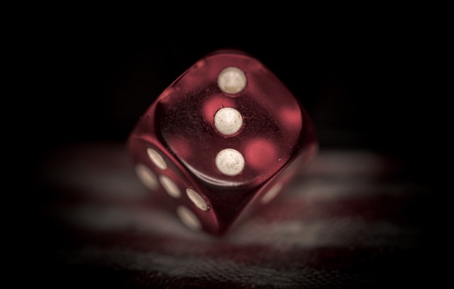 A die with three dots showing – a decorative image for this blog post on how to use an ellipsis.